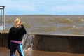 Little girl watching the wave