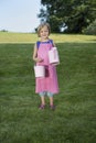 Little girl with watering can in the garden Royalty Free Stock Photo