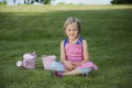 Little girl with watering can in the garden Royalty Free Stock Photo