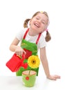 Little girl watering a daisy Royalty Free Stock Photo