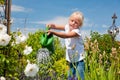 Little girl watering flowers Royalty Free Stock Photo