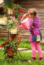 Little girl watering flowers Royalty Free Stock Photo