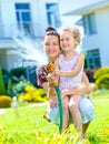 Little girl watering flowers Royalty Free Stock Photo