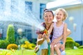 Little girl watering flowers Royalty Free Stock Photo