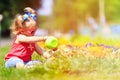 Little girl watering flowers in summer Royalty Free Stock Photo