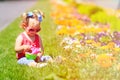 Little girl watering flowers in summer Royalty Free Stock Photo