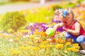 Little girl watering flowers in summer Royalty Free Stock Photo