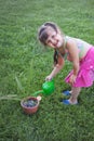 Little girl watering the plants