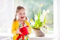 Little girl watering spring flowers Royalty Free Stock Photo