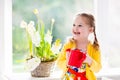 Little girl watering spring flowers Royalty Free Stock Photo