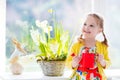 Little girl watering spring flowers Royalty Free Stock Photo