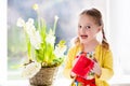 Little girl watering spring flowers Royalty Free Stock Photo