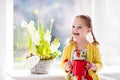 Little girl watering spring flowers Royalty Free Stock Photo