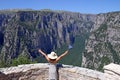 Little girl waves with a Greek flag on Vikos gorge Zagoria Royalty Free Stock Photo