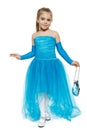 Little girl wearing blue ball dress in full length making curtsy