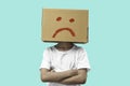 Little girl wearing cardboard box on his head with unglÃÂ¼cklich, Isolated Royalty Free Stock Photo