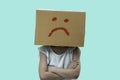 Little girl wearing cardboard box on his head with unglÃÂ¼cklich, Isolated Royalty Free Stock Photo