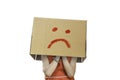 Little girl wearing cardboard box on his head with unhappy face Royalty Free Stock Photo