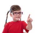 little girl wearing glasses and pointing by forefinger to somewhere Royalty Free Stock Photo