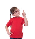 little girl wearing glasses and pointing by forefinger to somewhere up Royalty Free Stock Photo