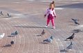 A little girl chasing pigeons Royalty Free Stock Photo