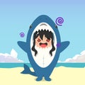 little girl wearing a shark costume character feeling dizzy isolated on a beach background. little girl wearing a shark costume
