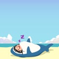 little girl wearing a shark costume character sleeping isolated on a beach background. little girl wearing a shark costume