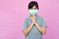 Little girl wearing sterile medical mask.