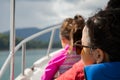 Little girl wearing sunglasses on a boat. View from behind. Vacation, travel and active kid concept Royalty Free Stock Photo