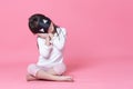 Little girl wearing white pajamas and black eyemask Royalty Free Stock Photo