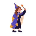 Little girl wearing witch costume in Halloween masquerade. Cute kid in wizard suit, mage cap, cloak spells with magic Royalty Free Stock Photo