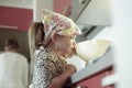 Little girl weighing flour for a birthday cake Royalty Free Stock Photo