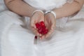 Communion girl dressed in white with hearts in her hands Royalty Free Stock Photo