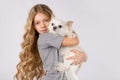 Little girl with white chihuahua dog on white background. Kids Pet Friendship Royalty Free Stock Photo