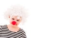 Little girl in white curly clown wig and red nose Royalty Free Stock Photo