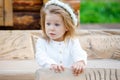 Little girl in a white dress in the village Royalty Free Stock Photo