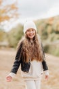 little girl in white hat and black leather jacket autumn photography