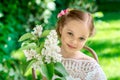 Little girl with white lilac flowers Royalty Free Stock Photo