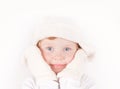 Little girl in winter hat with ear flaps