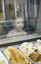 Little girl wishes ice cream in pastry shop