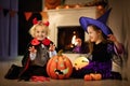 Kids in witch costume on Halloween trick or treat Royalty Free Stock Photo