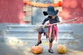 little girl in witch costume celebrate Halloween outdoor and have fun