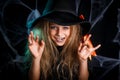 Little girl in witch costume having fun on Halloween trick or treat. Royalty Free Stock Photo