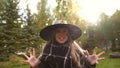 Little girl in witch costume roaring at camera, frightening viewers, Halloween