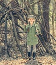 Little girl in the wood near hut Royalty Free Stock Photo