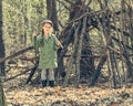 Little girl in the wood near hut Royalty Free Stock Photo