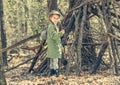 Little girl in the wood near hut Royalty Free Stock Photo