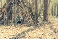 Little girl in the wood near hut Royalty Free Stock Photo