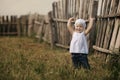 Little girl and wooden fence Royalty Free Stock Photo