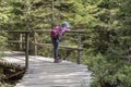 Little girl on wooden path in forest near Oppenau, Black Forest, Germany